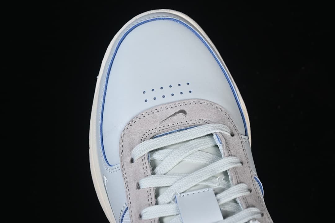 Top view of the perforated toe and lace panel