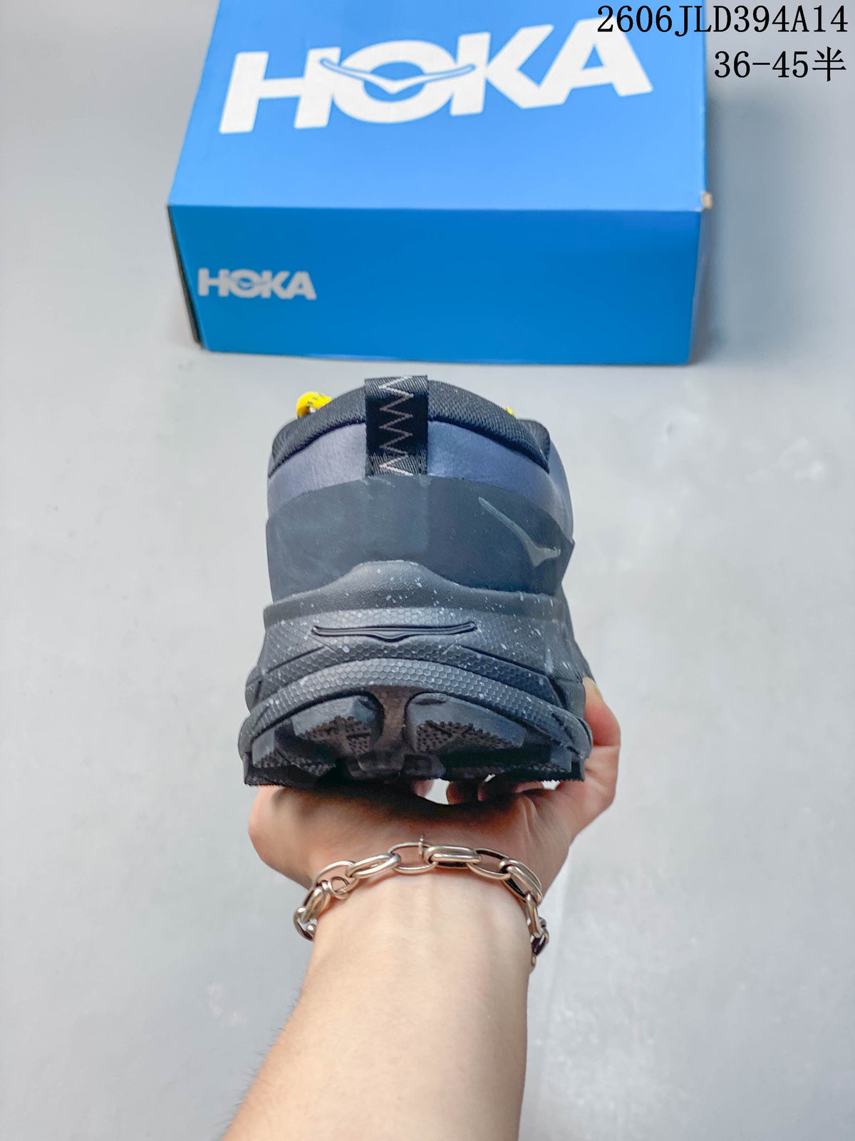 Rear view showing the heel and tread of a blue-gray shoe.