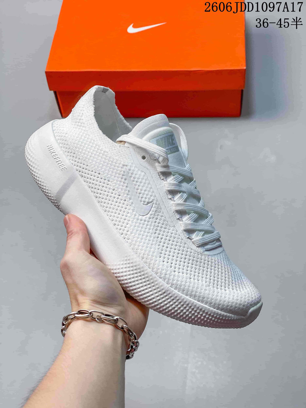 White Nike Free 2025 low-top shoe with a white Swoosh and sole.