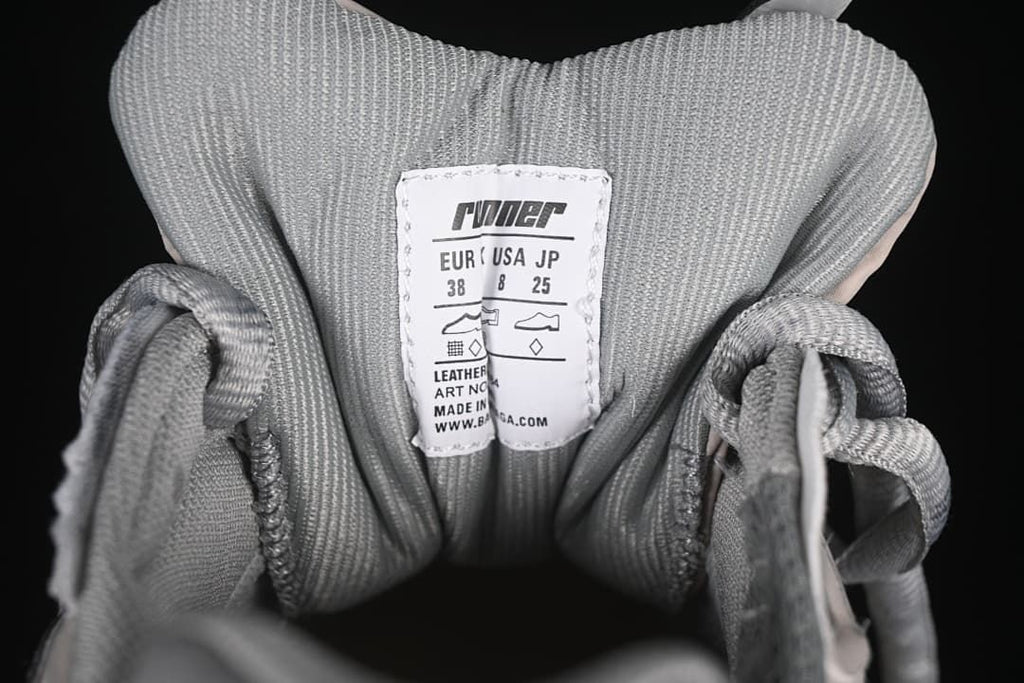 Tongue size label on the photographed shoe showing EU 38, US 8, and JP 25.