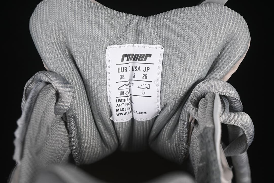 Tongue size label on the photographed shoe showing EU 38, US 8, and JP 25.