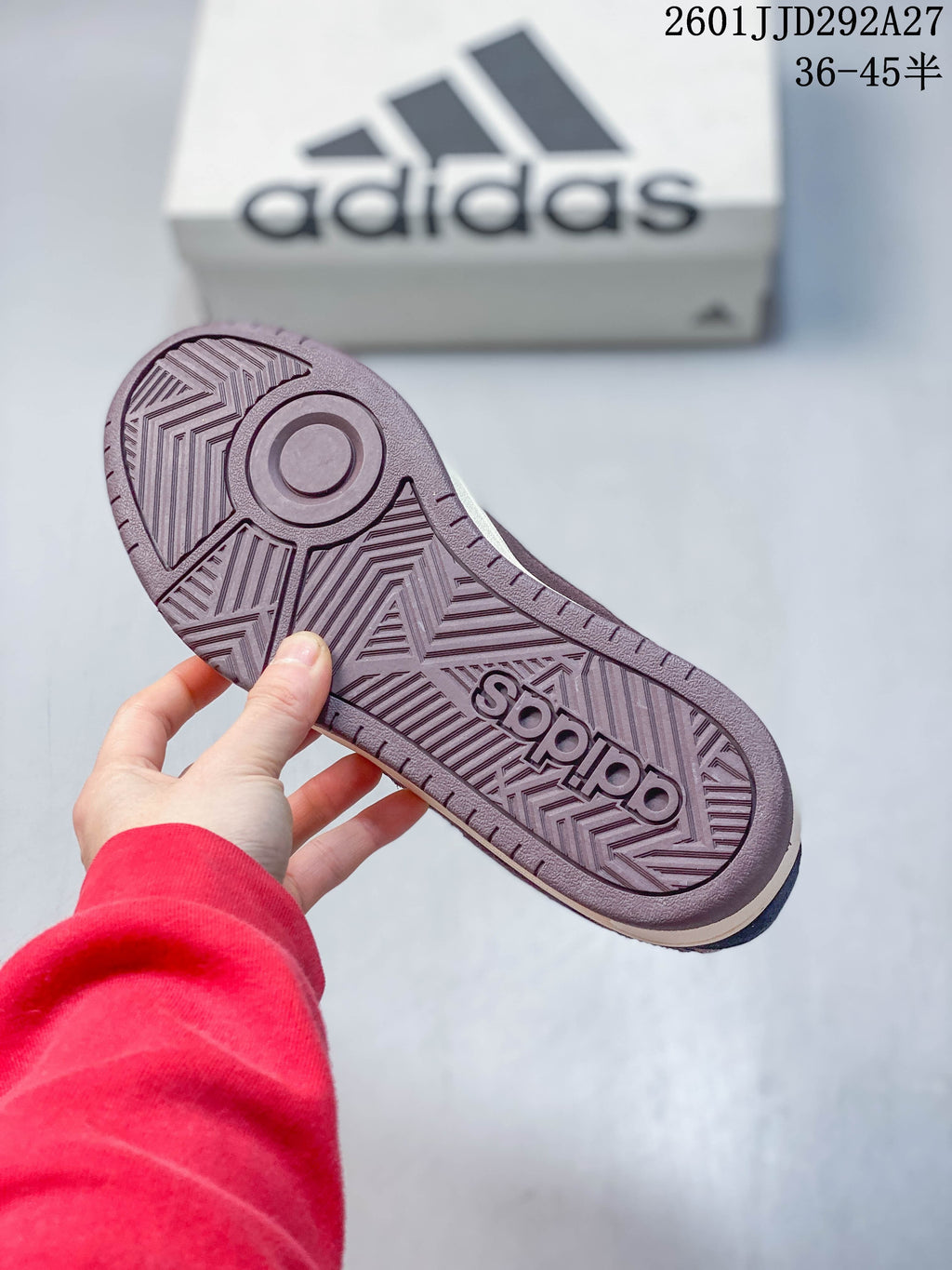 Close-up of the patterned plum-colored outsole of an Adidas Wcard Adv sneaker.