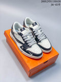 Pair of white and navy low-top sneakers with patterned panels and gray-and-white laces