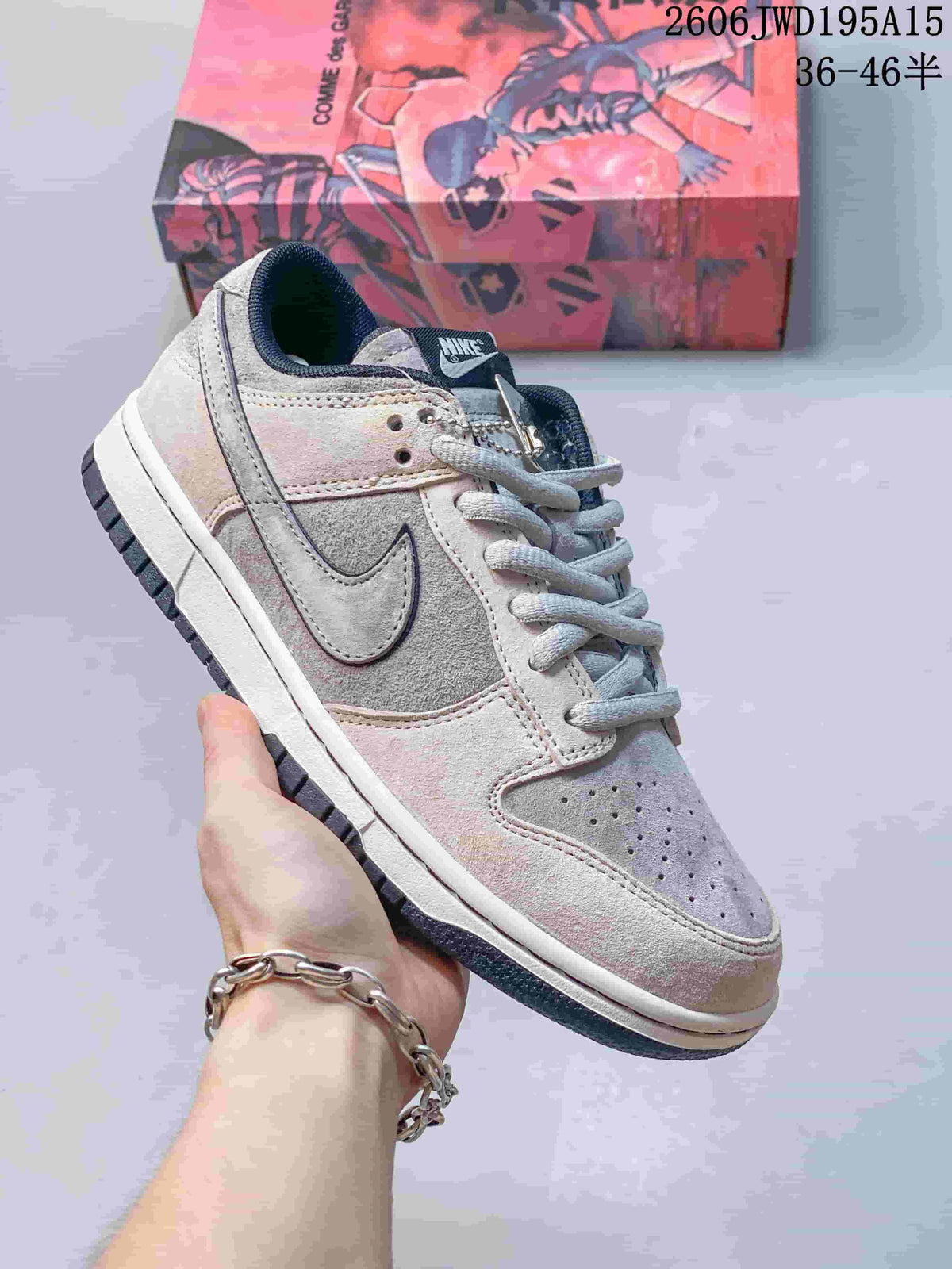 Nike SB Zoom Dunk Low sneaker in white and gray with a dark gray toe panel.