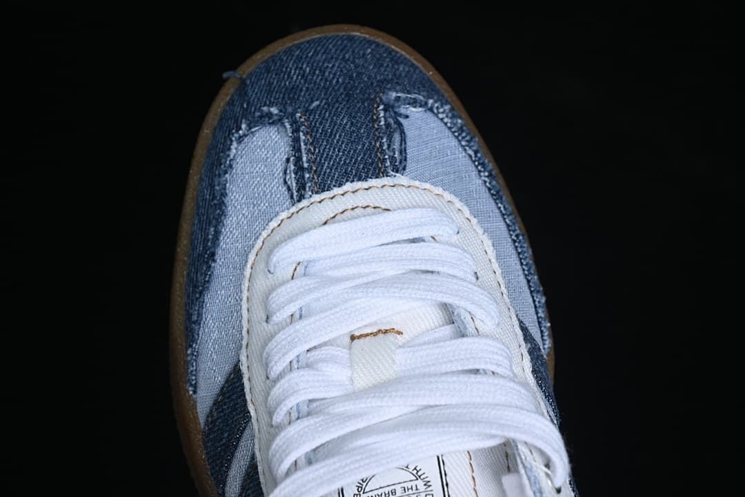 Top-down view of the denim-look toe and white laces