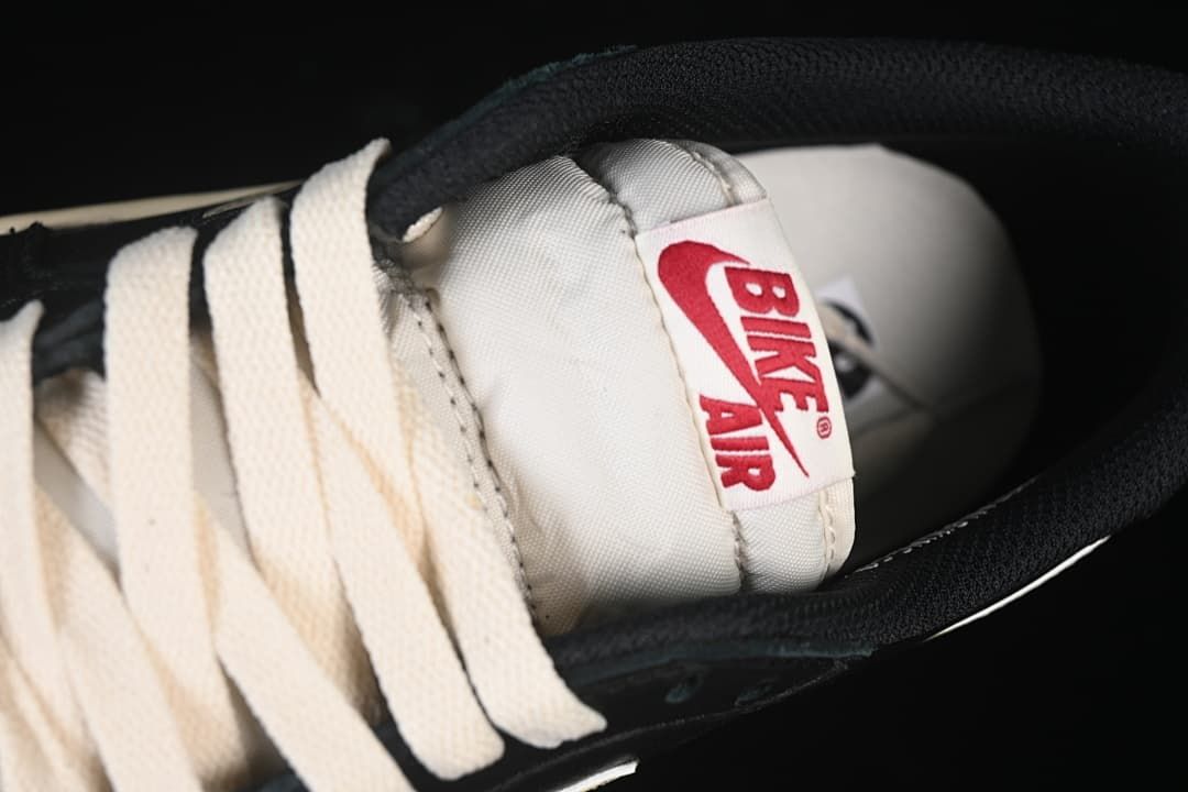Close-up of cream laces and a tongue label marked Bike Air