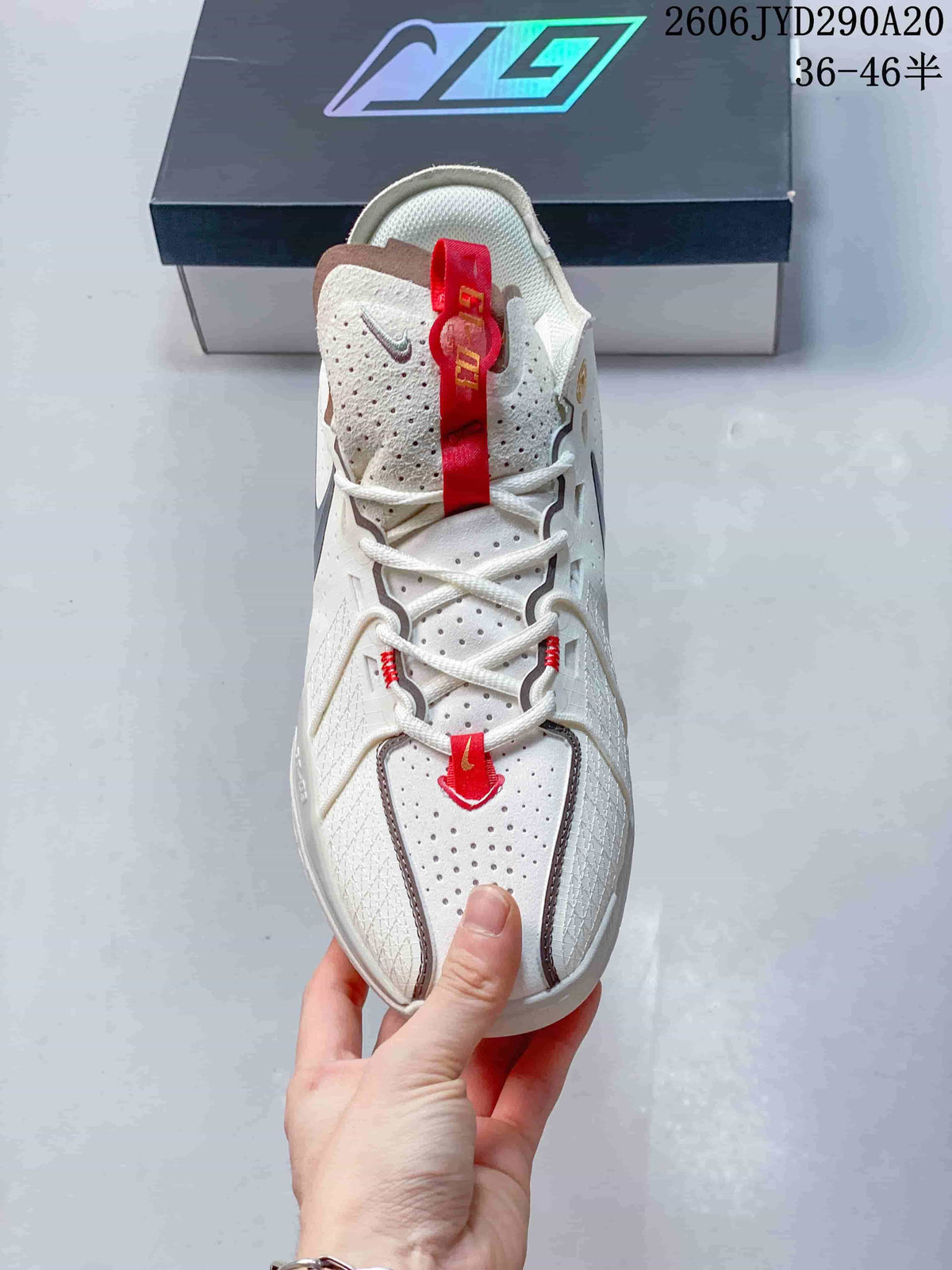 Top view showing perforations, laces, and red tongue pull tab