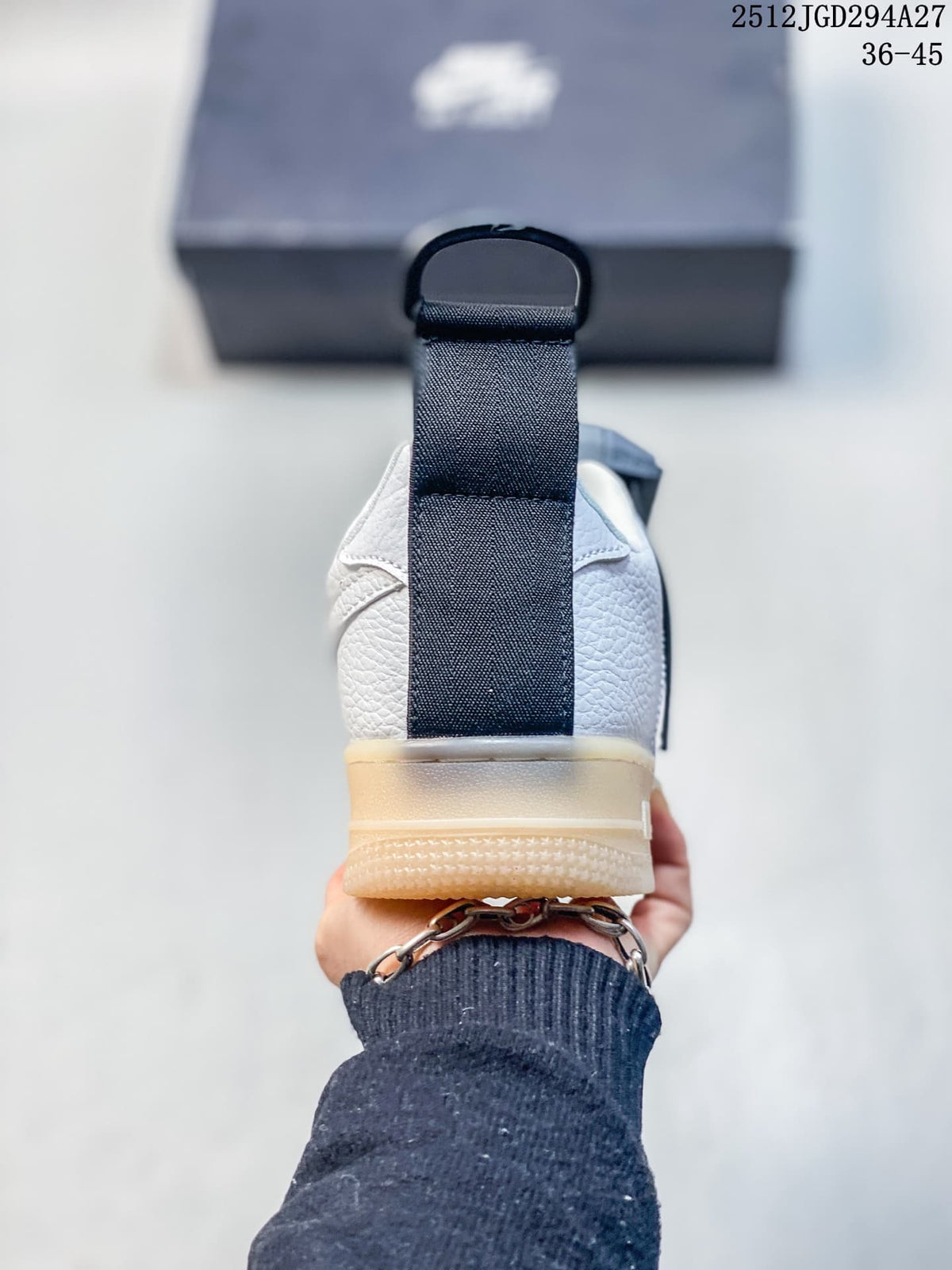 Rear view showing the heel pull tab and gum-tone sole