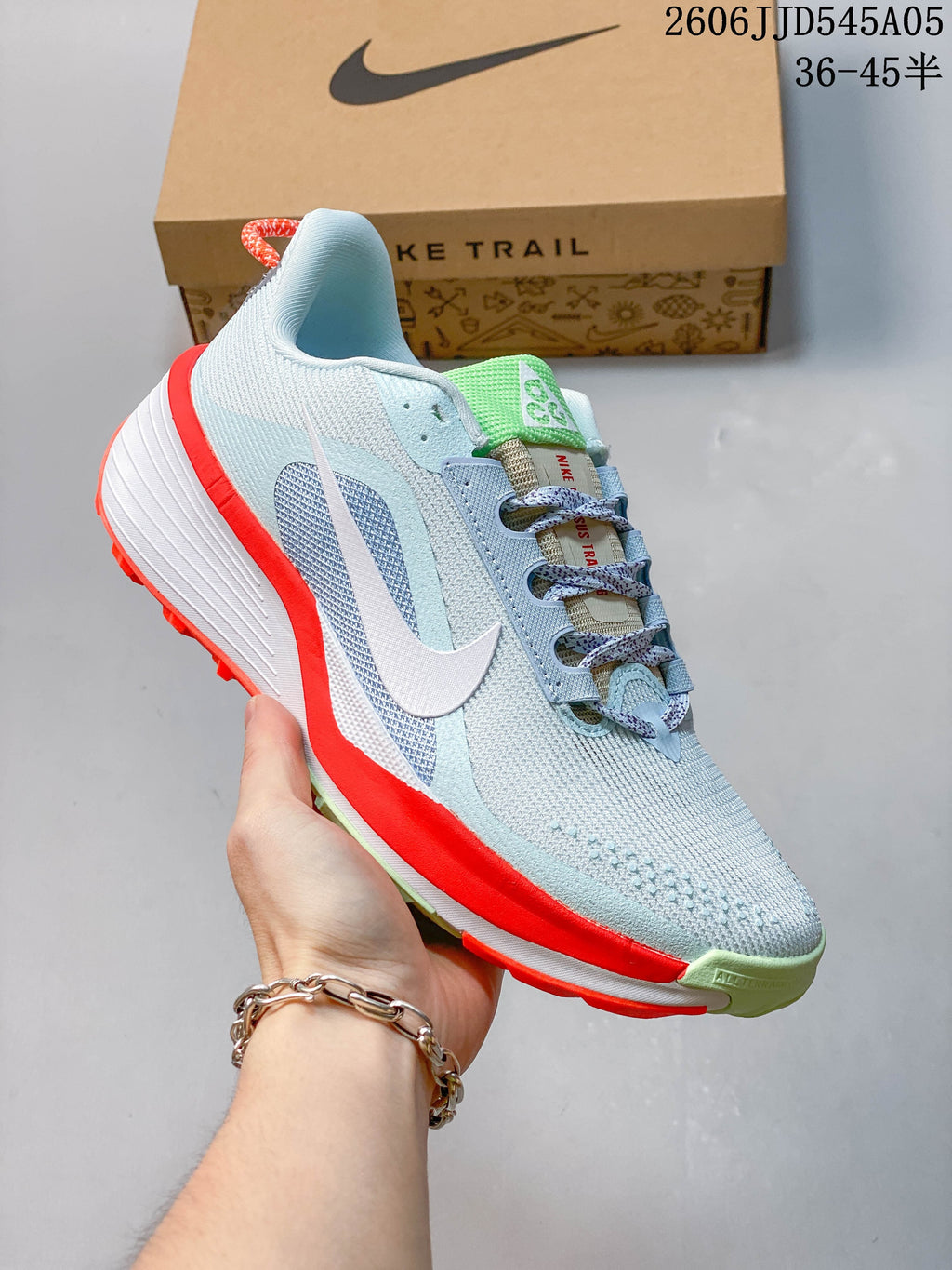 Angled view of the light blue Nike Pegasus Trail 6 shoe with white Swoosh and contrasting outsole accents.