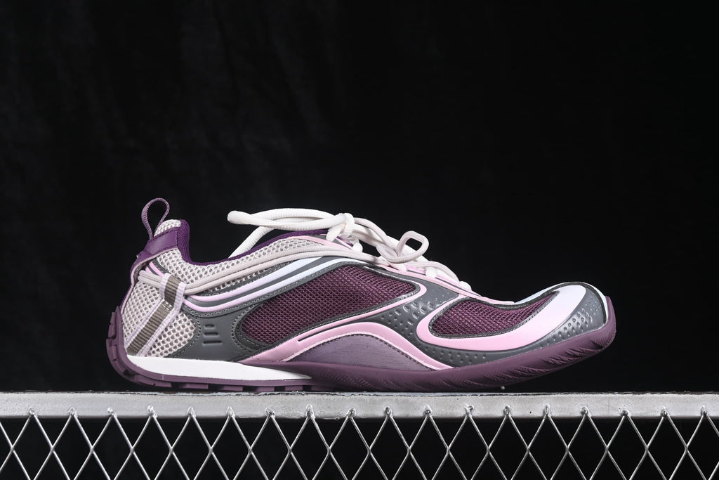 Opposite side profile of a purple and pink Balenciaga Radar sneaker with layered panels and a textured outsole.