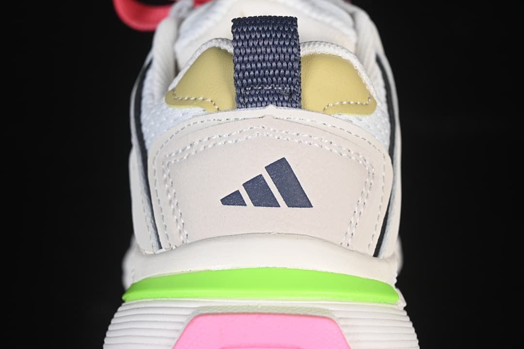 Rear close-up of the sneaker with Adidas logo and pink and lime green accents.