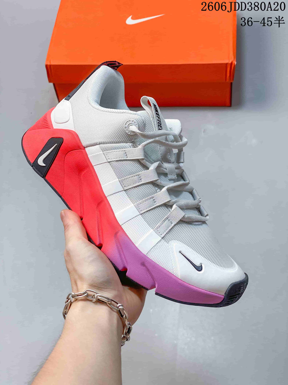 Angled side view of the Nike Free Metcon 7 showing its white upper and colorful sole accents.