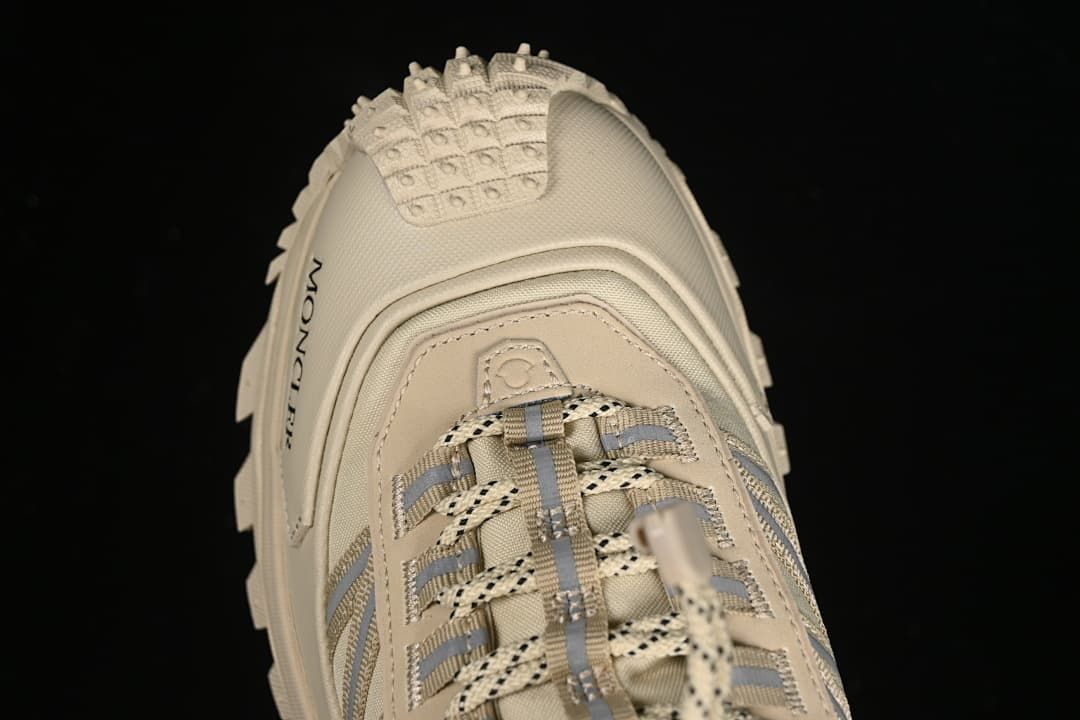 Top-front close-up showing the lacing and textured toe area.