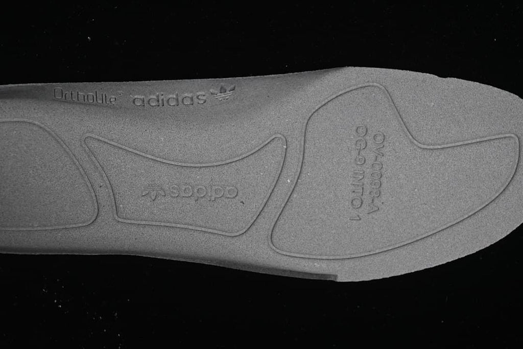 Close-up of the insole underside with embossed markings