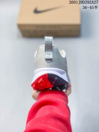 Rear view of the Nike trail sneaker showing the heel pull tab, padded collar, and red-and-black outsole sections.