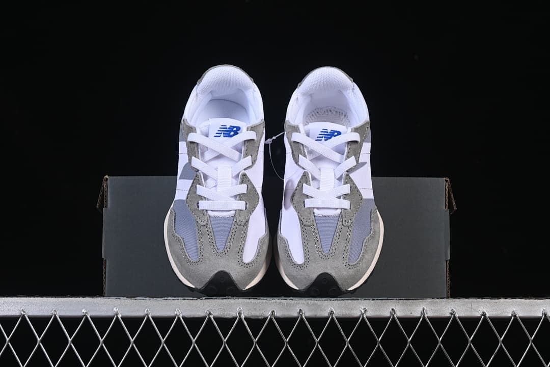 Pair of New Balance 327 sneakers shown from the front.