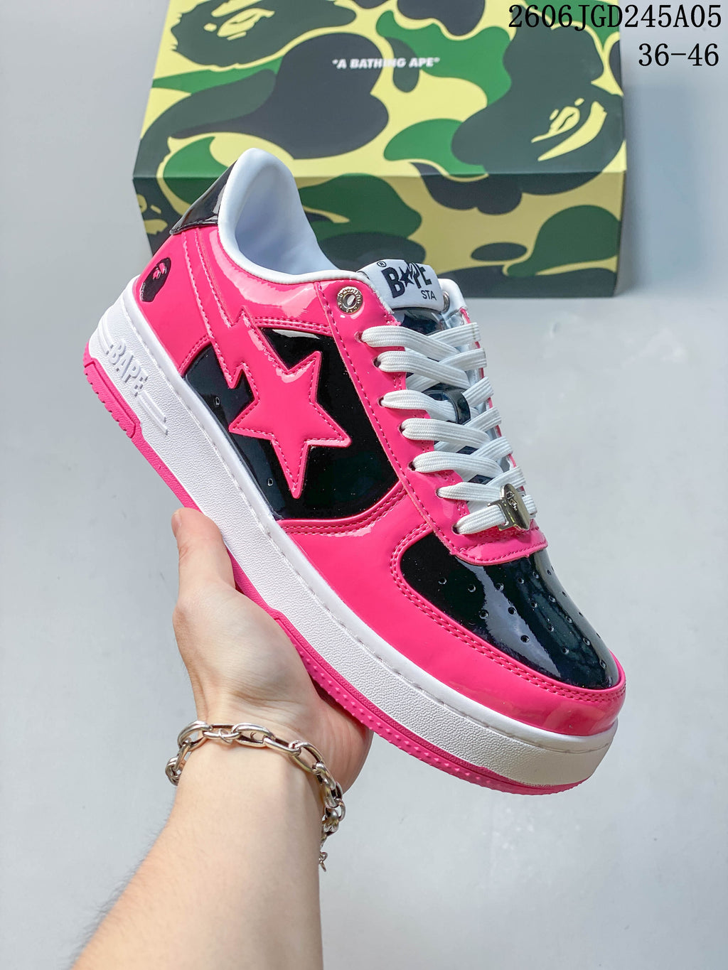 Close-up of a pink and black BAPE STA sneaker with a star-shaped side detail