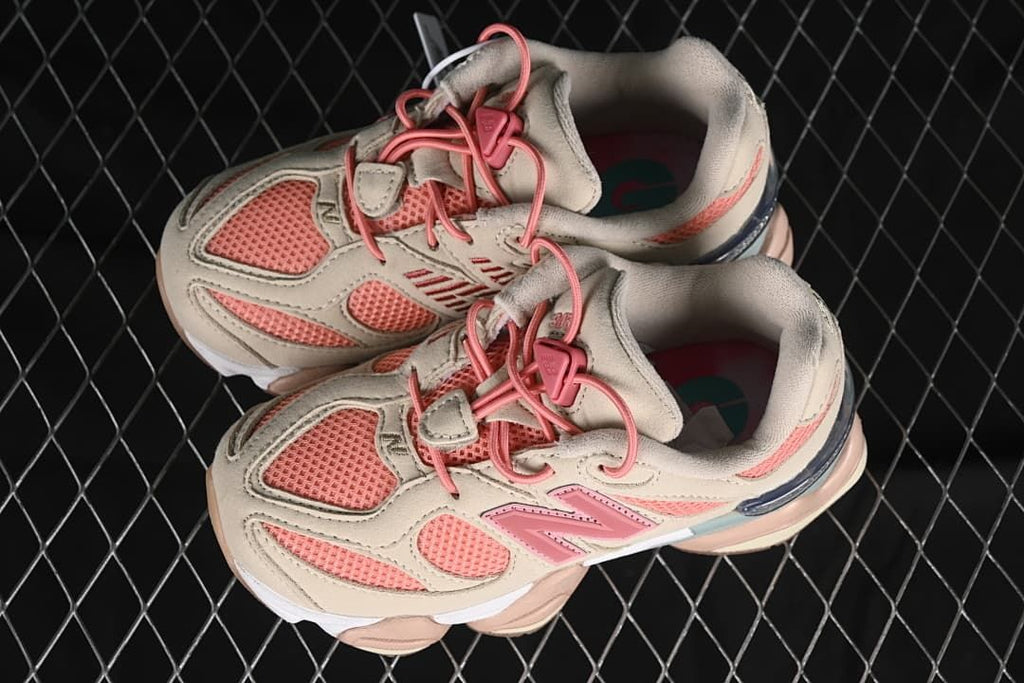 Pair of beige and pink sneakers viewed from above