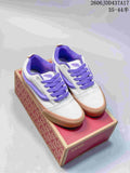Pair of gray and purple Vans Knu Skool sneakers with gum-colored soles, shown on a shoe box.