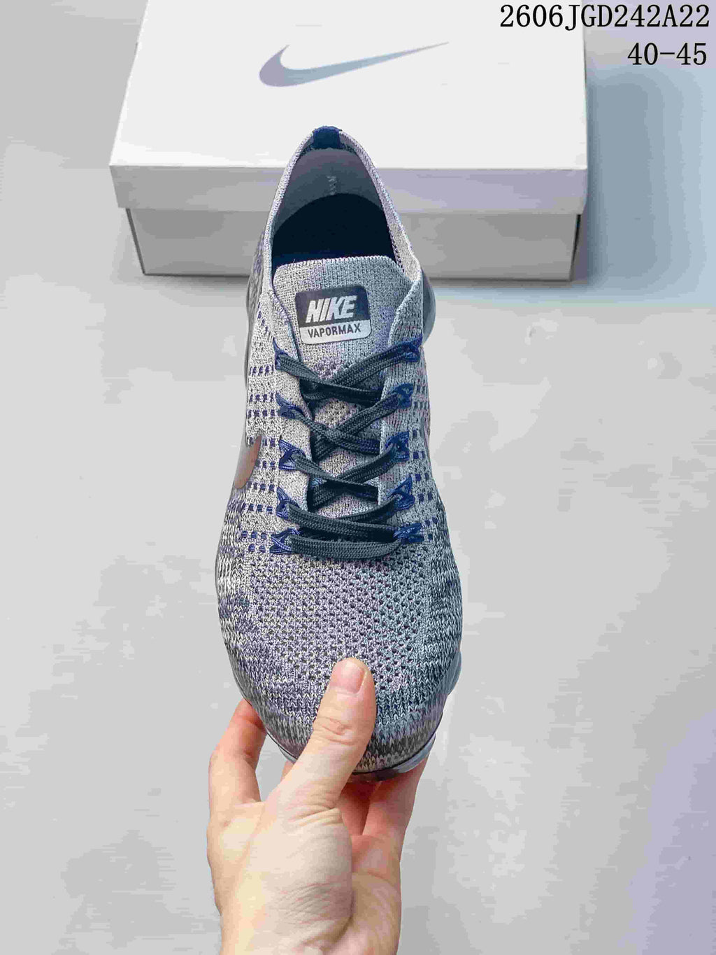 Front view of the gray knit-look Nike VaporMax sneaker with dark laces