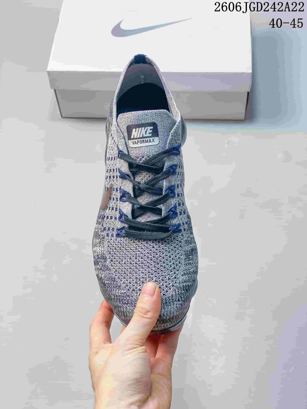 Front view of the gray knit-look Nike VaporMax sneaker with dark laces