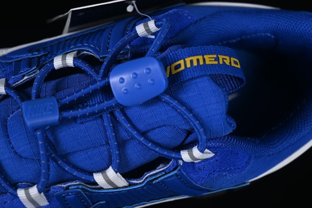 Close-up of the blue laces, lace toggle, and tongue branding