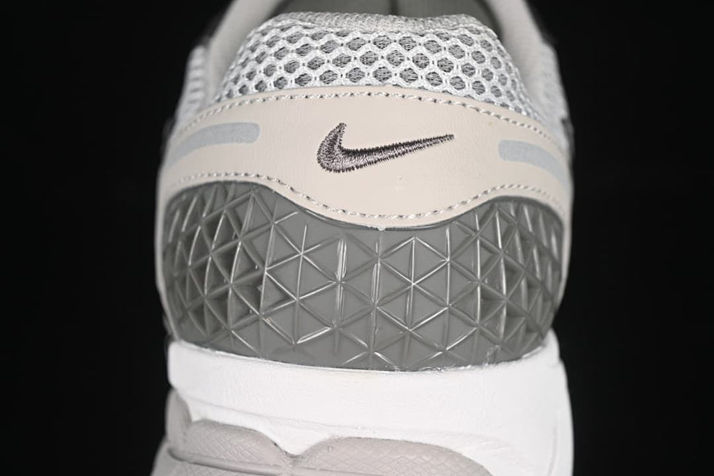 Rear view showing the textured heel panel and small Swoosh.