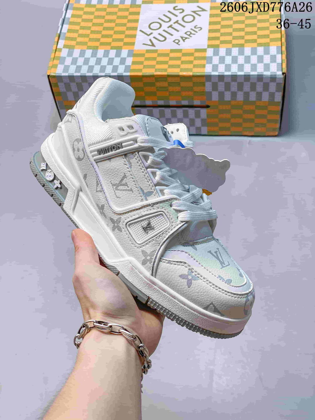 White Louis Vuitton Trainer Low sneaker with a pale monogram-style pattern