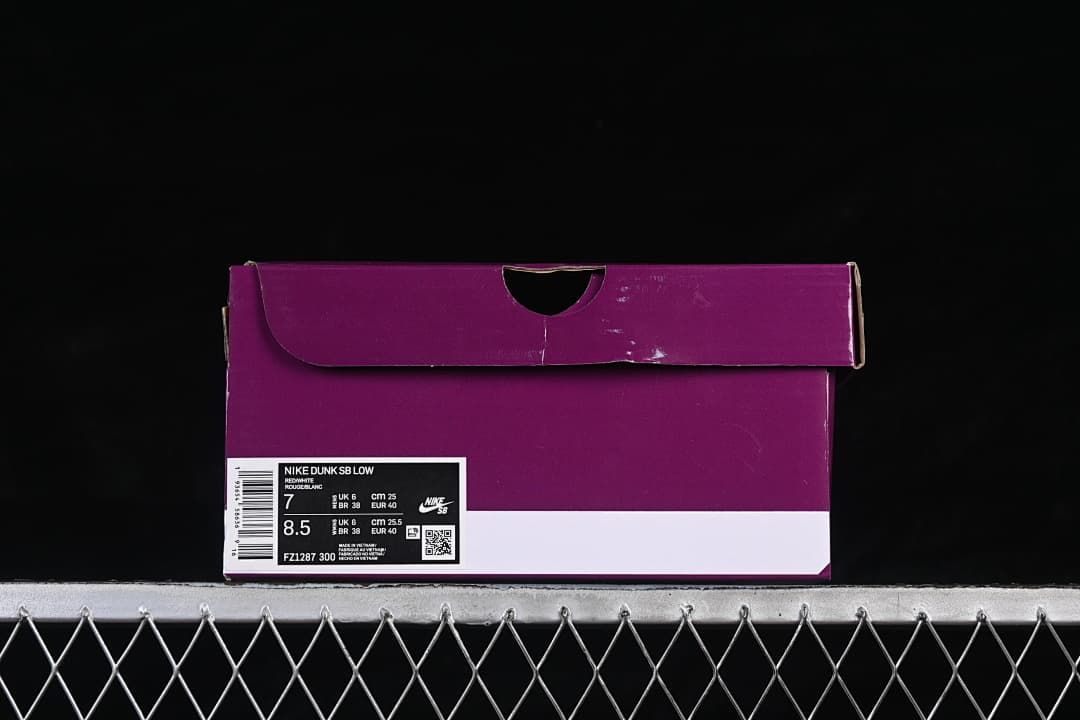 Purple shoe box with a label showing Nike Dunk SB Low, style code FZ1287-300, and sample size markings.