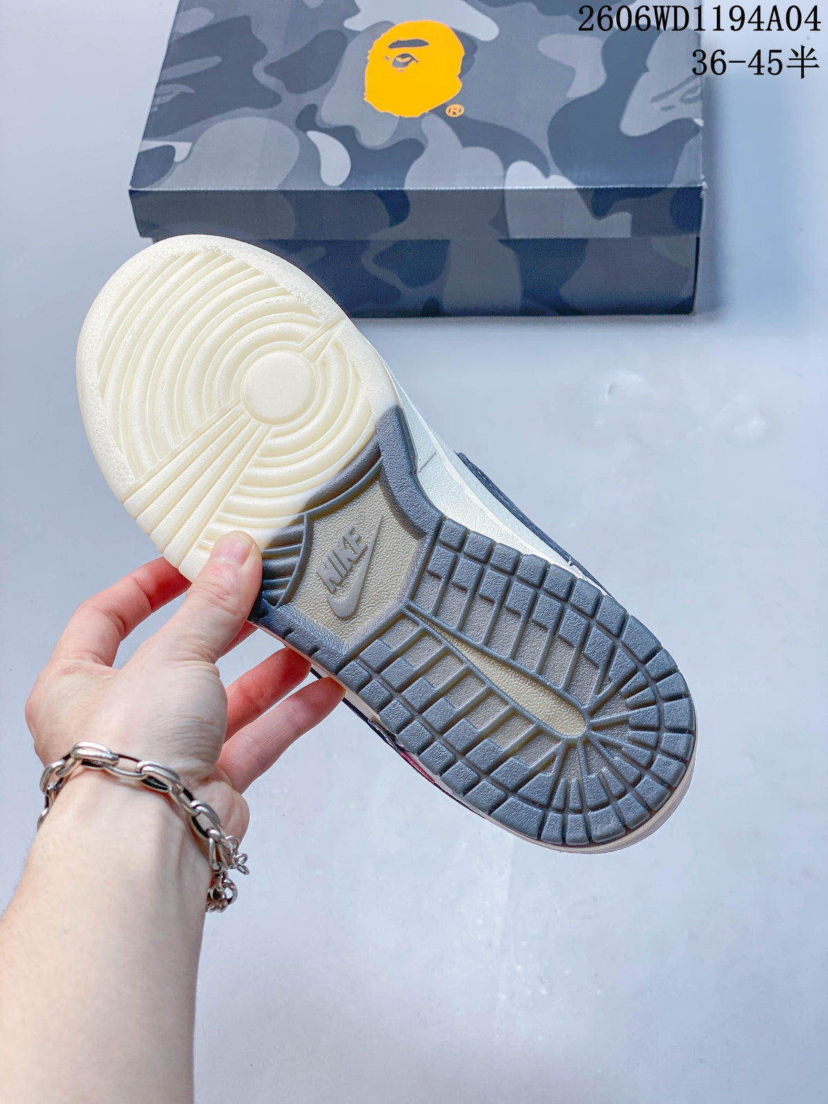 View of the sneaker outsole and camouflage-patterned box