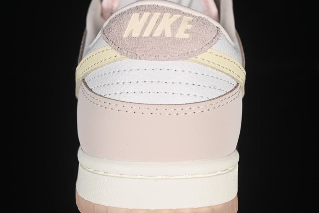 Rear view showing layered heel panels and pale yellow accents