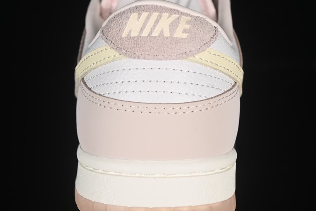 Rear view showing layered heel panels and pale yellow accents