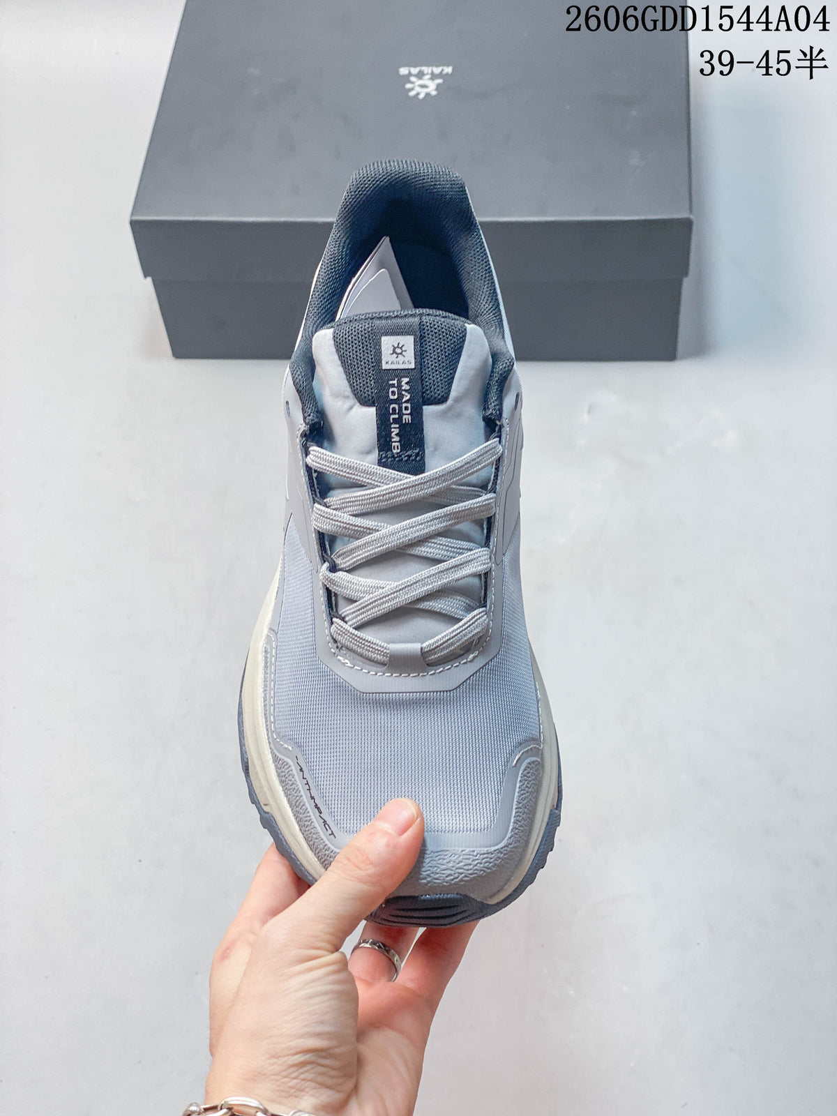 Front view of a light grey lace-up hiking shoe.