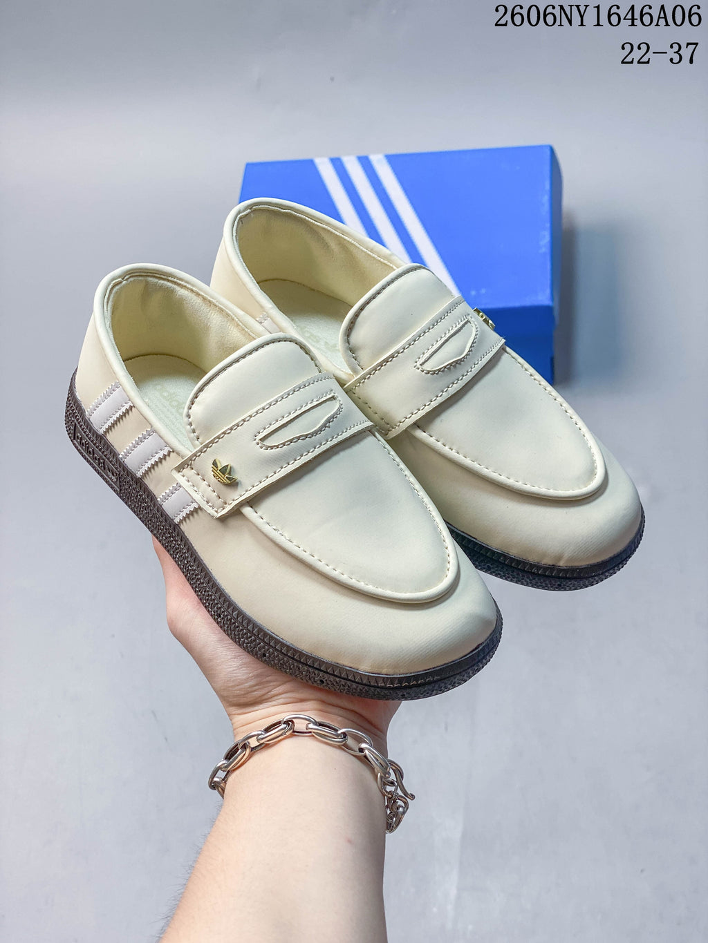 Pair of cream Adidas Handball Spezial loafer-style shoes with dark gum-look soles