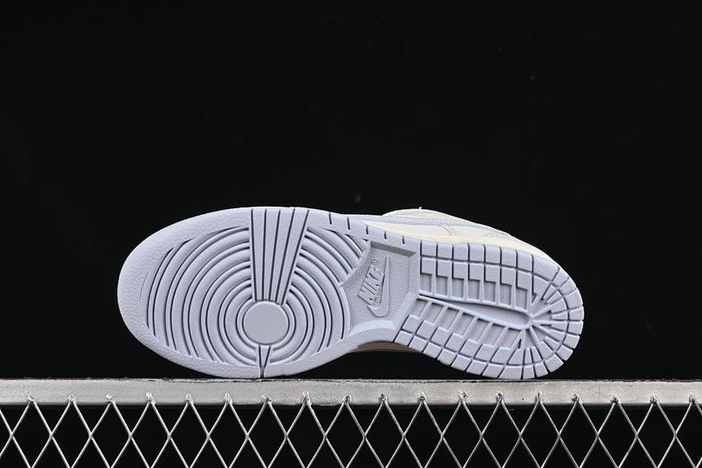 Underside view showing the tread pattern and light blue outsole