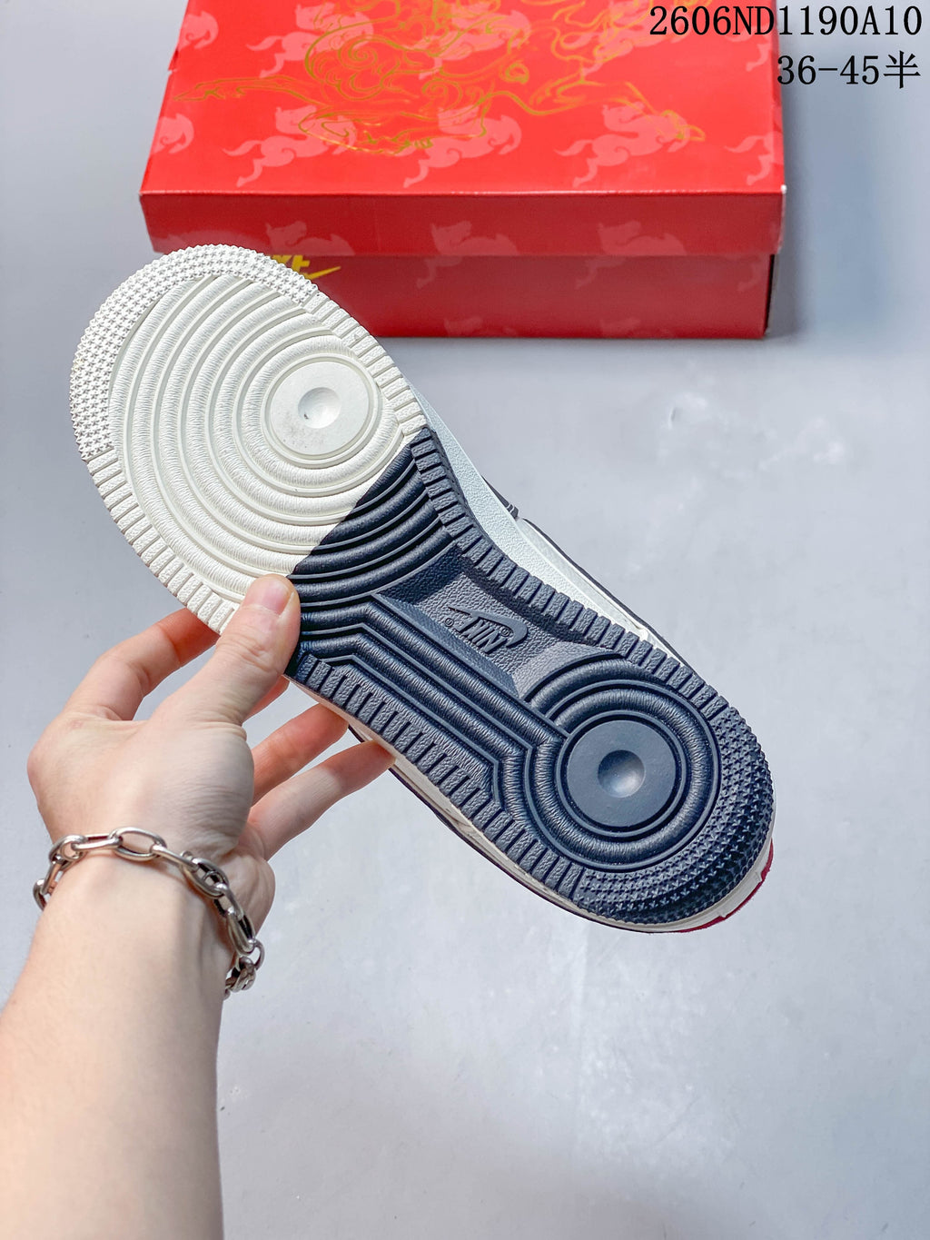 Close-up of the sneaker outsole with white and navy sections