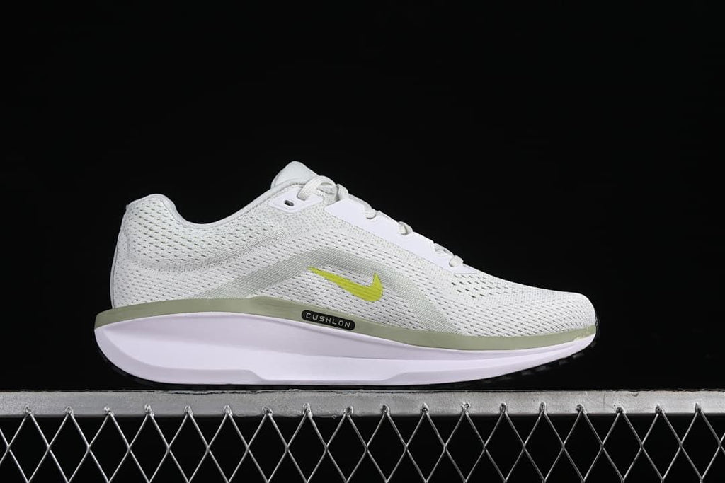 Side profile highlighting the mesh-patterned upper, small Swoosh and sculpted sole.