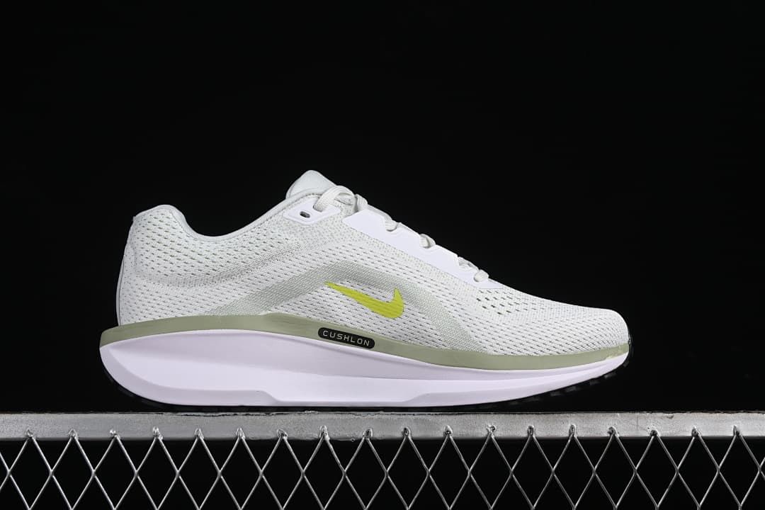 Side profile highlighting the mesh-patterned upper, small Swoosh and sculpted sole.