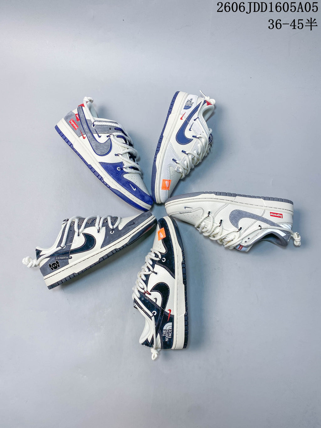 Overhead arrangement of several low-top sneakers in different colorways and graphic treatments.