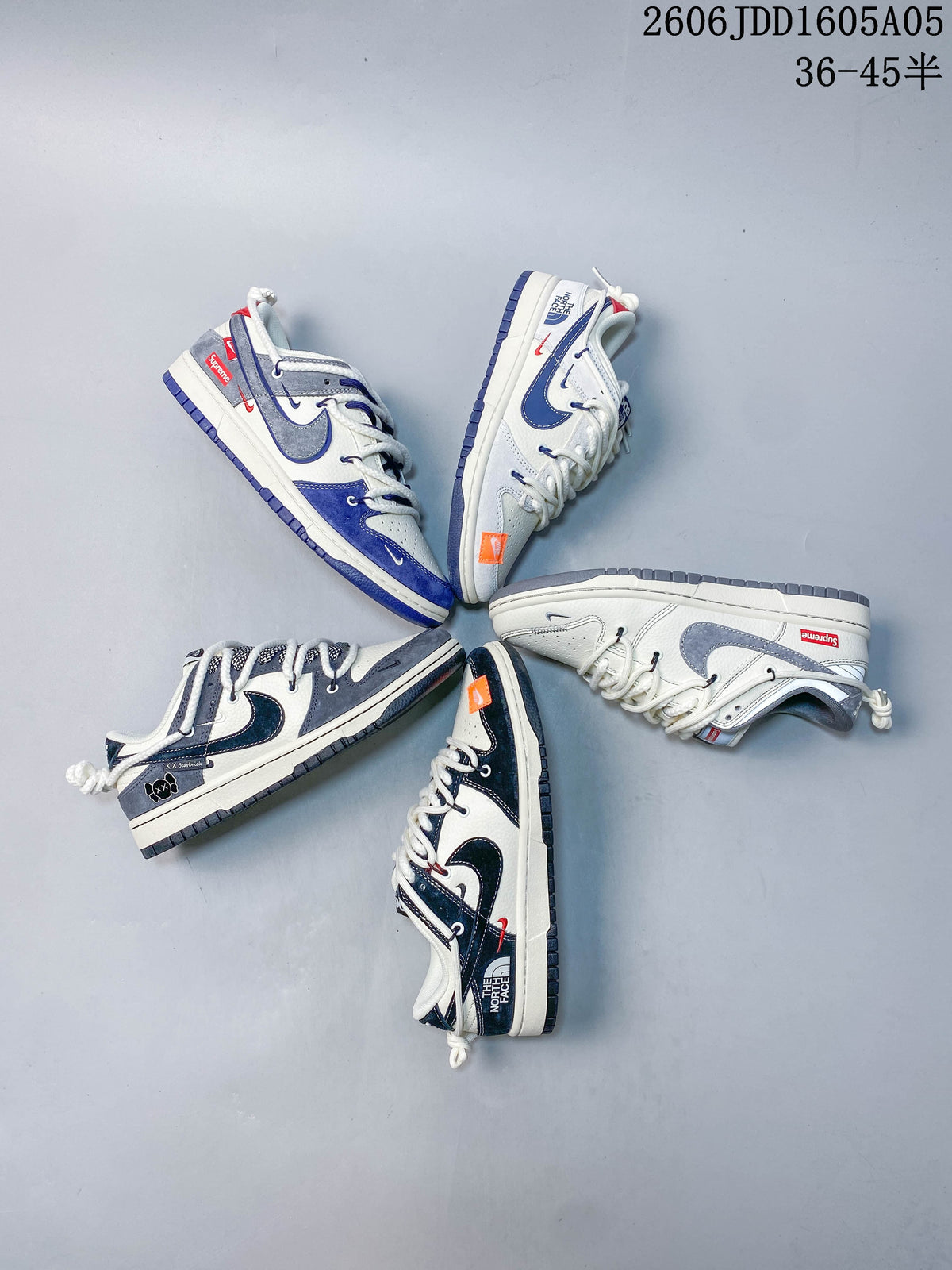 Overhead arrangement of several low-top sneakers in different colorways and graphic treatments.