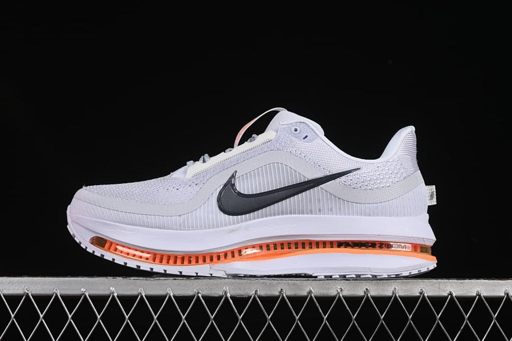Side profile of one shoe with orange cushioning detail