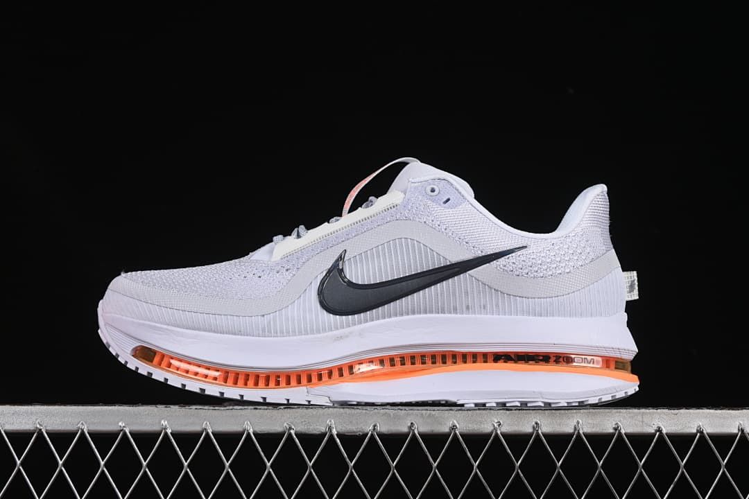 Side profile of one shoe with orange cushioning detail