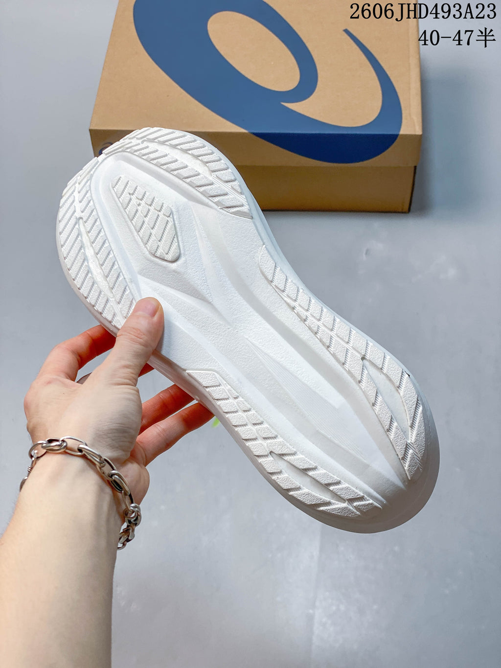 Textured outsole of a white running shoe