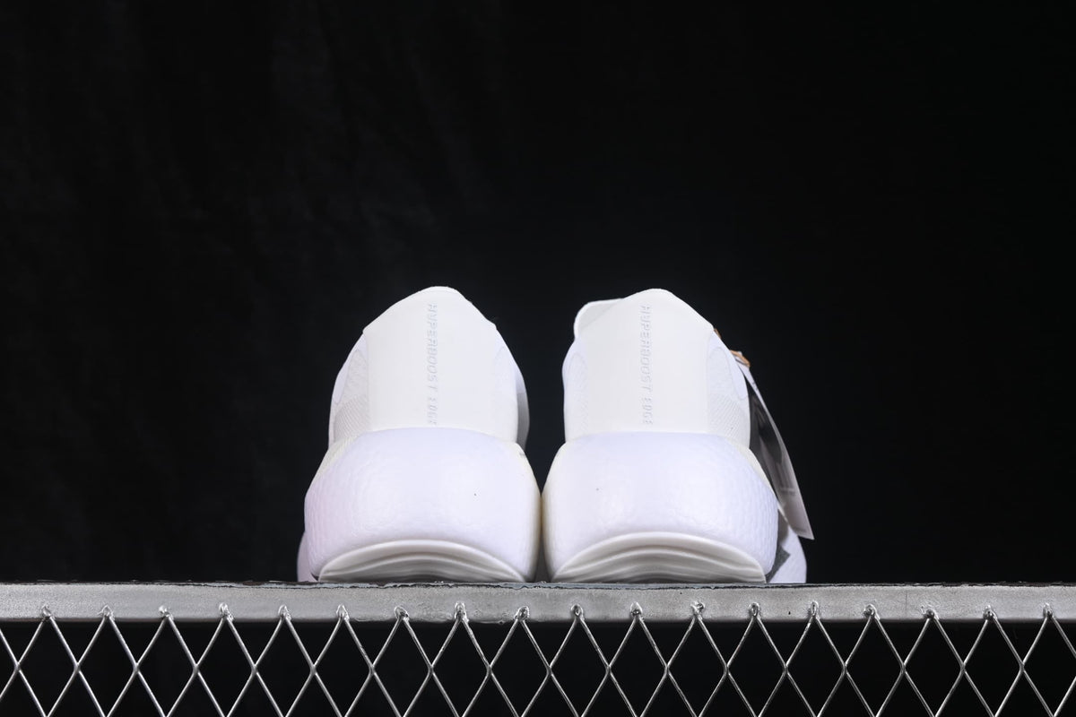 Rear view of the pair showing the padded heel areas and thick white soles.