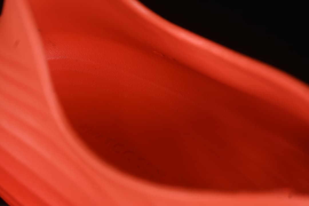 Close-up of the inside of the orange clog sandal