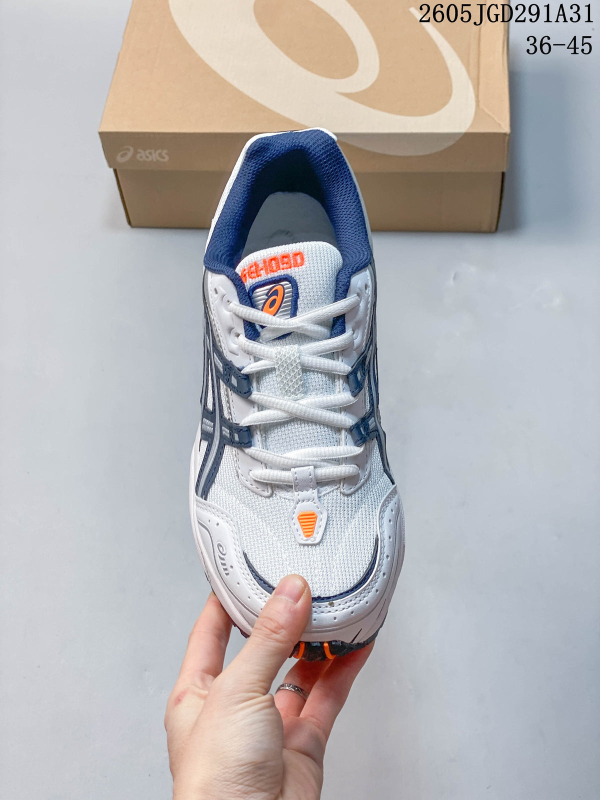 Top view of the sneaker showing white laces and a navy padded collar.