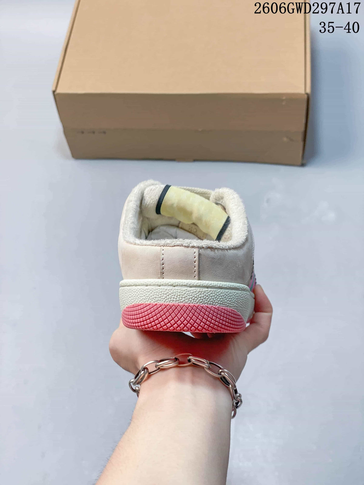Rear view showing the padded heel and pink outsole section.