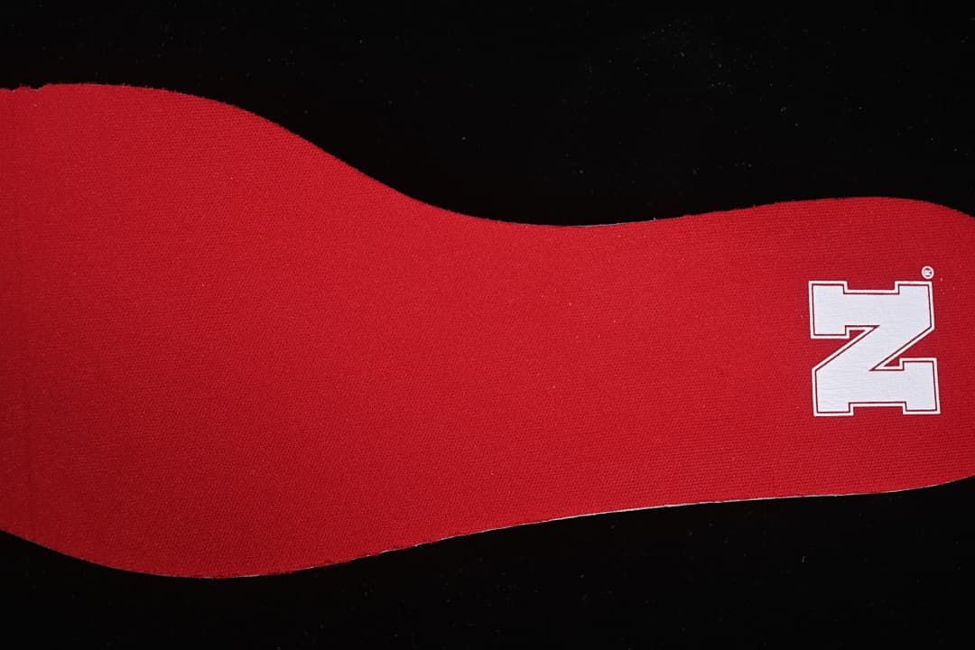 Red insole with a white Nebraska N logo