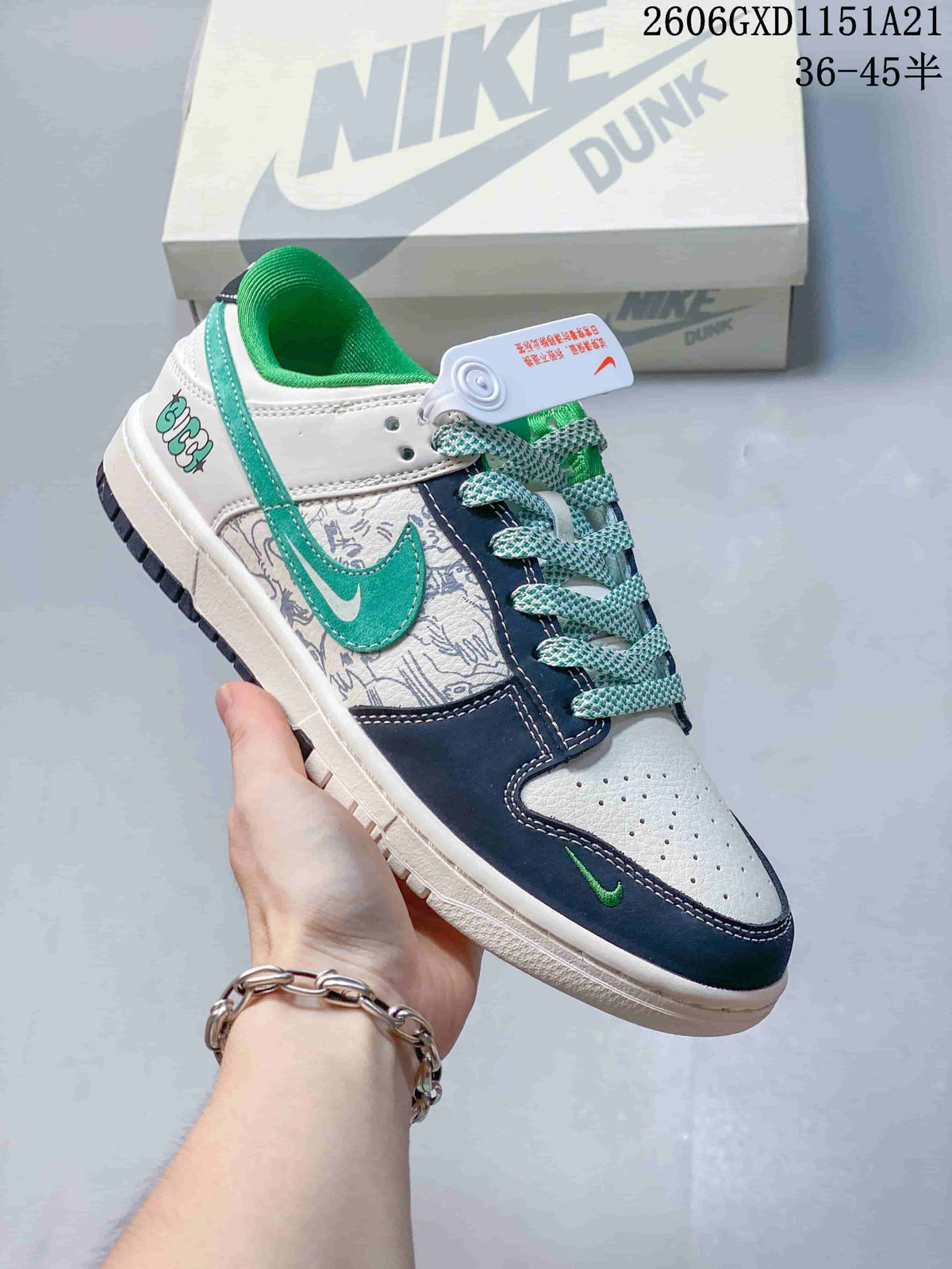 Angled side view of the white, navy, and green sneaker with graphic heel detail