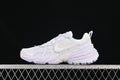 Side view of a white Nike V2K Run sneaker against a dark background